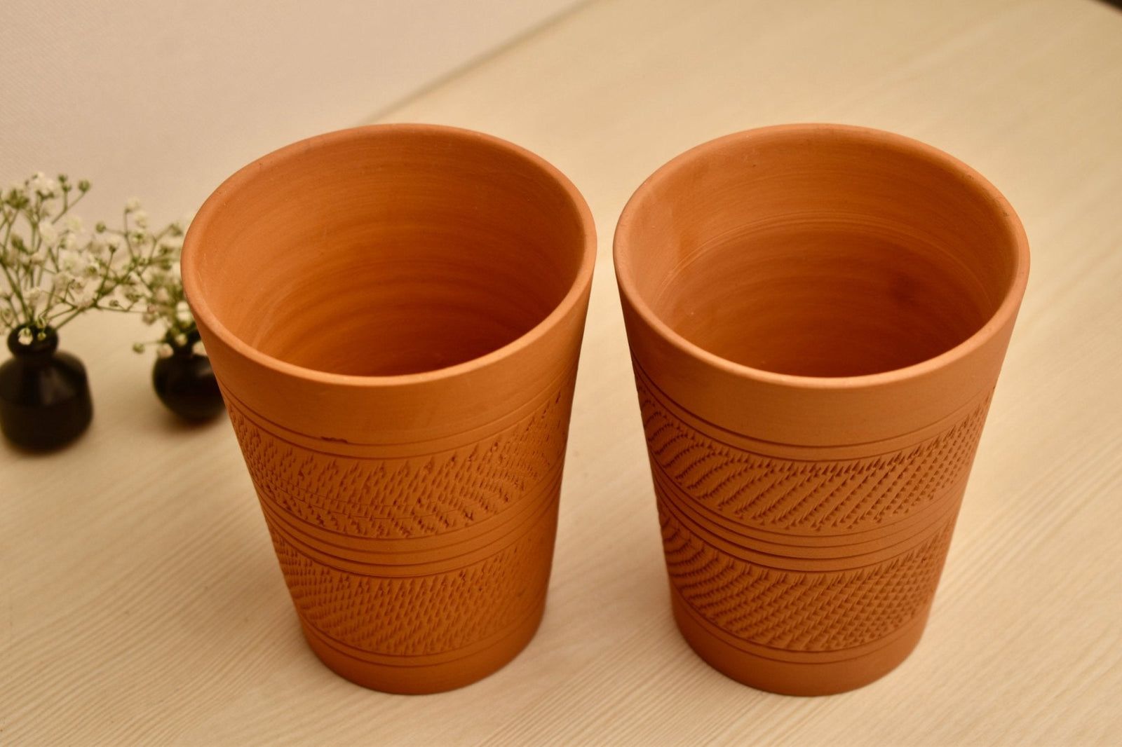 Moru Mug Lifestyle – Handcrafted Earthen Clay Mug Pair on Wooden Surface