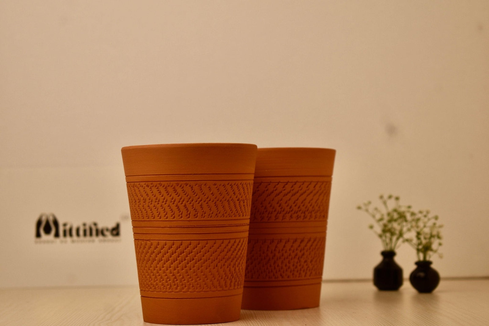 Patiala Pint Set Lifestyle – Handcrafted Clay Pint Glasses on Wooden Table